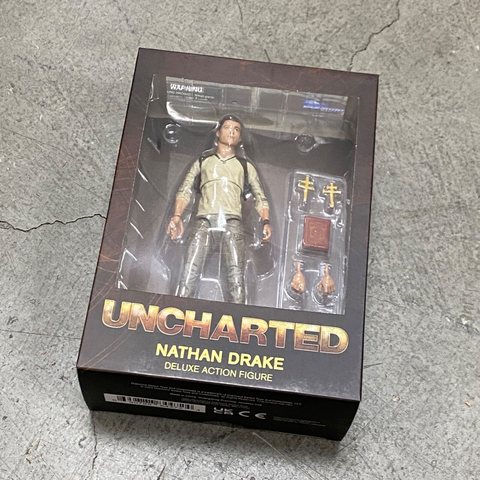 MAR222292: Diamond Select Uncharted Nathan Drake Deluxe Action Figure