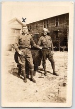 1940s Black  White Photo Of Two Army Soldiers Standing Out Side Of The Barracks