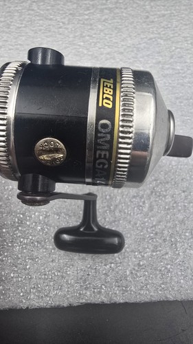 Carrete de pesca fundido gatillo ultra ligero Zebco Omega 144XL de colección funciona - Imagen 5 de 6