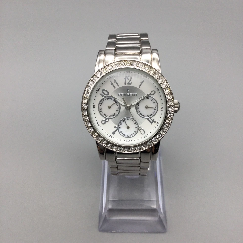 Reloj Peugeot Mujer 35mm Tono Plata Cristales Día Fecha Batería Nueva 6.5" Foto 3 de 4