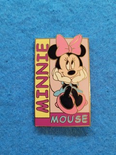 Disney Auctions pin featuring Minnie sitting and looking pretty