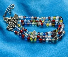 GLASS BEADS BRACELET RED BLUE CLEAR HANDMADE SILVER TONE ACCENTS EXPANDABLE