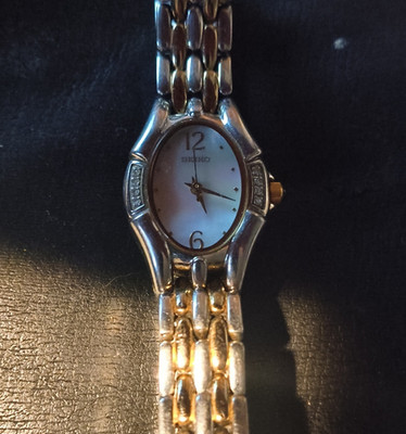 Seiko Oval Silver Gold Analog Wristwatch 5 Bar Water-Resistant Stainless Steel