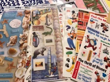 Assorted Scrapbook 12x12 papers, stickers, and embellishments kit.