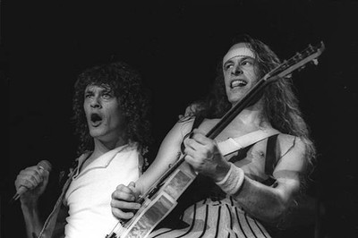 Brian Howe singer Ted Nugent guitarist during a concert of their b- Old Photo