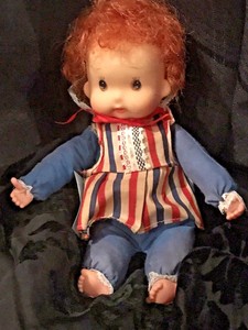 old doll with red hair