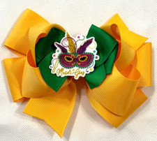 Beautiful Mardi Gras Mask inspired hair bow for girls.