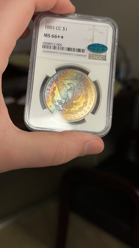 1883-CC NGC & CAC MS66+* Star Morgan Silver Dollar Rainbow Toning - Video 1 of 1