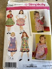 Simplicity Pattern # 4286 Toddlers/Girls Aprons 5 Variations Sizes 3-8 New