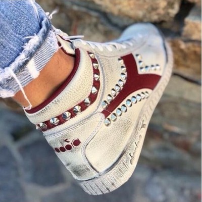 diadora bianche con borchie
