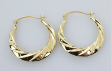 Twisted Hollow Huggie Hoop Earrings in 14k Yellow Gold