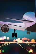 Airplane Touching Down on Runway of Airport at Night Travel Poster 16x24