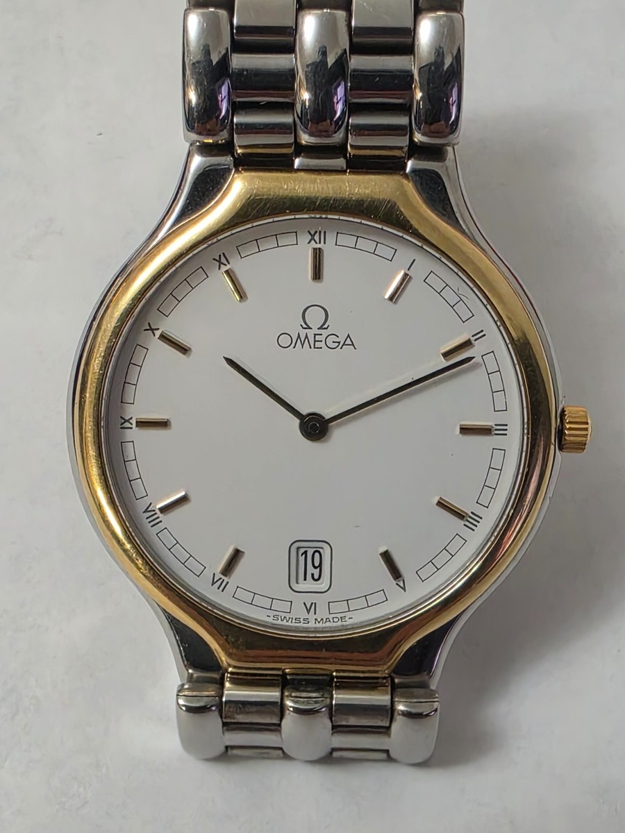 VINTAGE OMEGA DE VILLE SYMBOL QUATZ DATE WHITE DIAL 18K