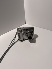 Nikon COOLPIX 7600 7.1MP Digital Camera - Silver*WORKING* *BROKEN BATTERY DOOR*