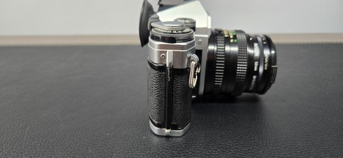 Objectif Canon AE-1 argent/50 mm f1,8 MF, Hanimex HMC 75-300 mm, enrouleur électrique, sacoche - Photo 10/24