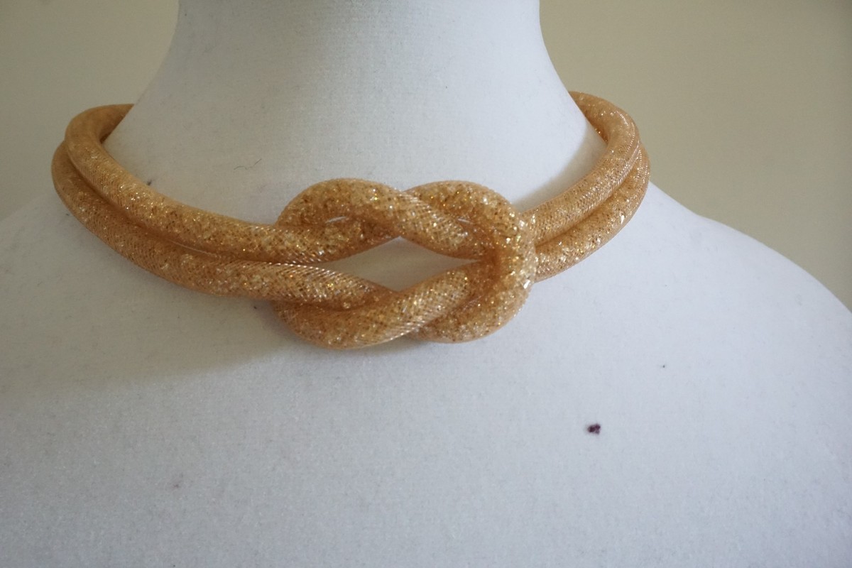 Swarovski Gold-Tone Knotted Stardust Dra Mixed Metal 5110617 no box