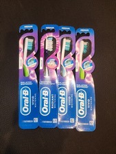 4x Oral-B Vivid Whitening Manual Medium Toothbrushes (Assorted Colors)