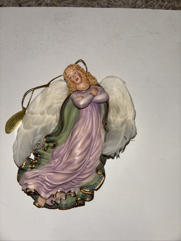 2000 Bradford Exchange  Celestial Angels Ornament Collection . An angel’s light.