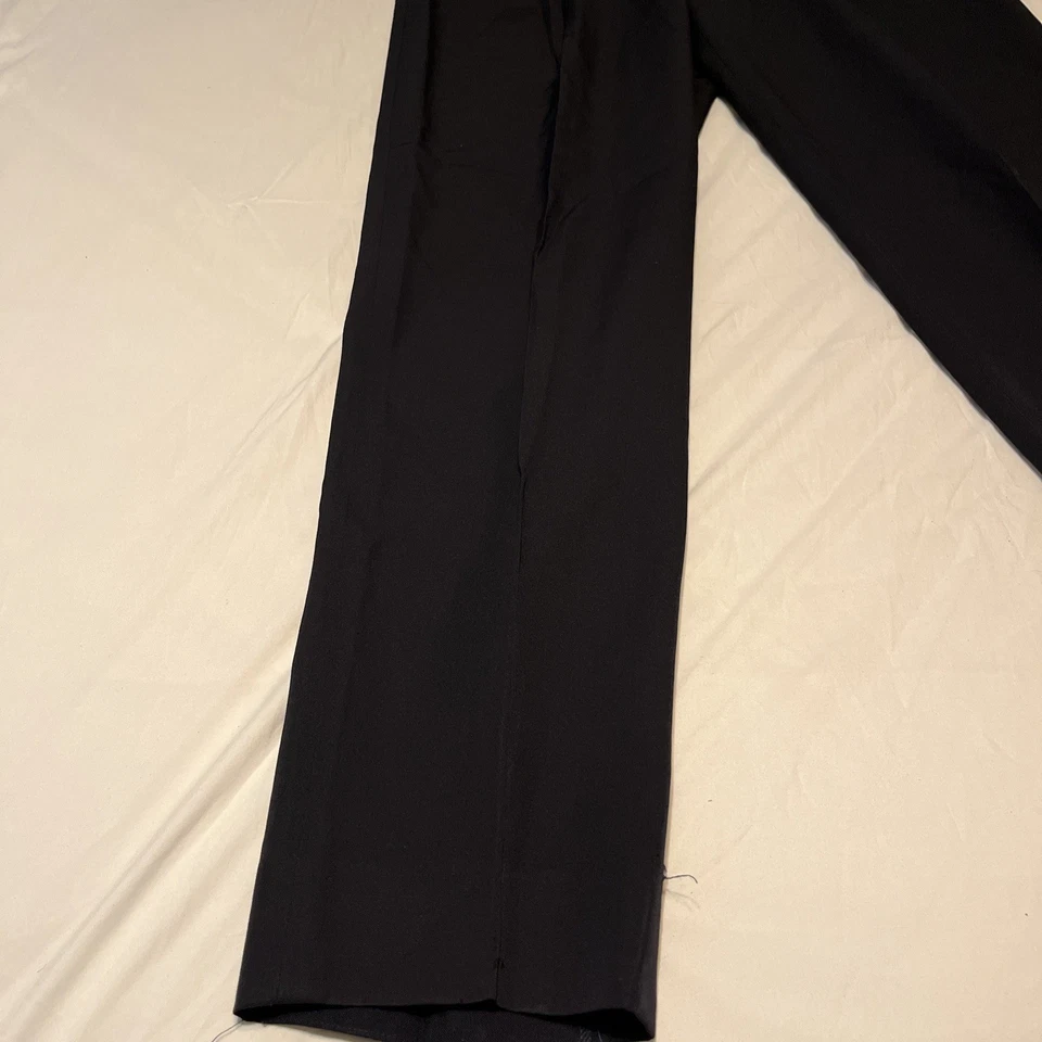 Pantalones de colección Comme Des Garcons Homme pantalones talla mediana tiene pequeños agujeros en la parte delantera Foto 4 de 4
