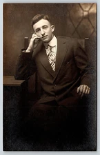 VINTAGE PICTURE PHOTO POSTCARD OLD PHOTOGRAPH YOUNG MAN SUIT TIE CHAIR RPPC