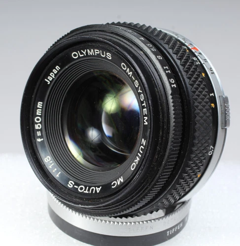 OLYMPUS OM ZUIKO 50MM F/1.8 LENS WITH FACTORY CAPS