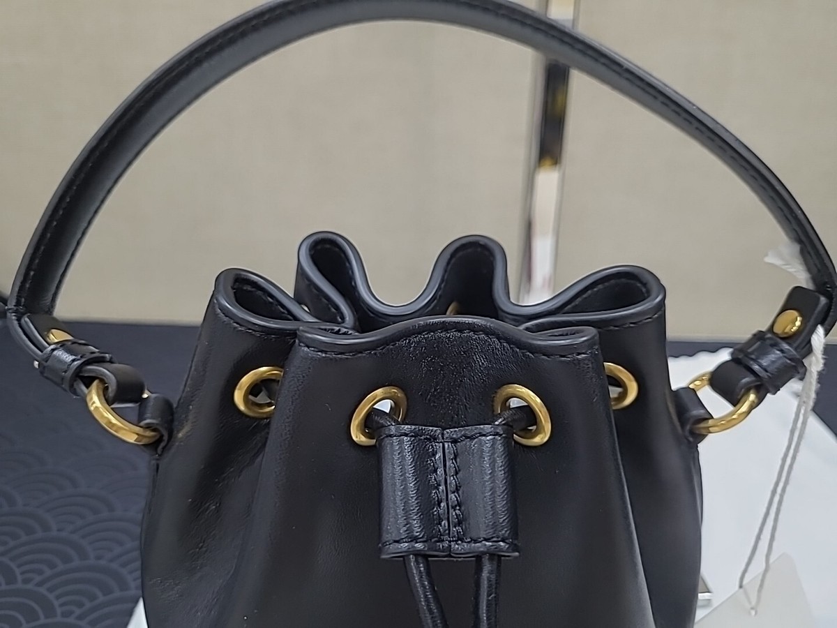 バッグ・カバンその他 VLOGO SIGNATURE SMALL BUCKET BAG WITH FRINGES Valentino Garavani Vlogo mini bucket bag | The Fashion Square