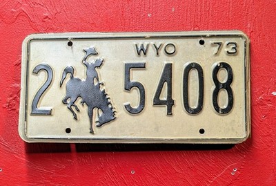 Collectible Wyoming License Plate  With A Bucking  Horse White/ Black Lettering