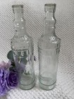 Pair Of Clear Glass Decorative Bottles-12.5” Tall-Embossed Vintage Style