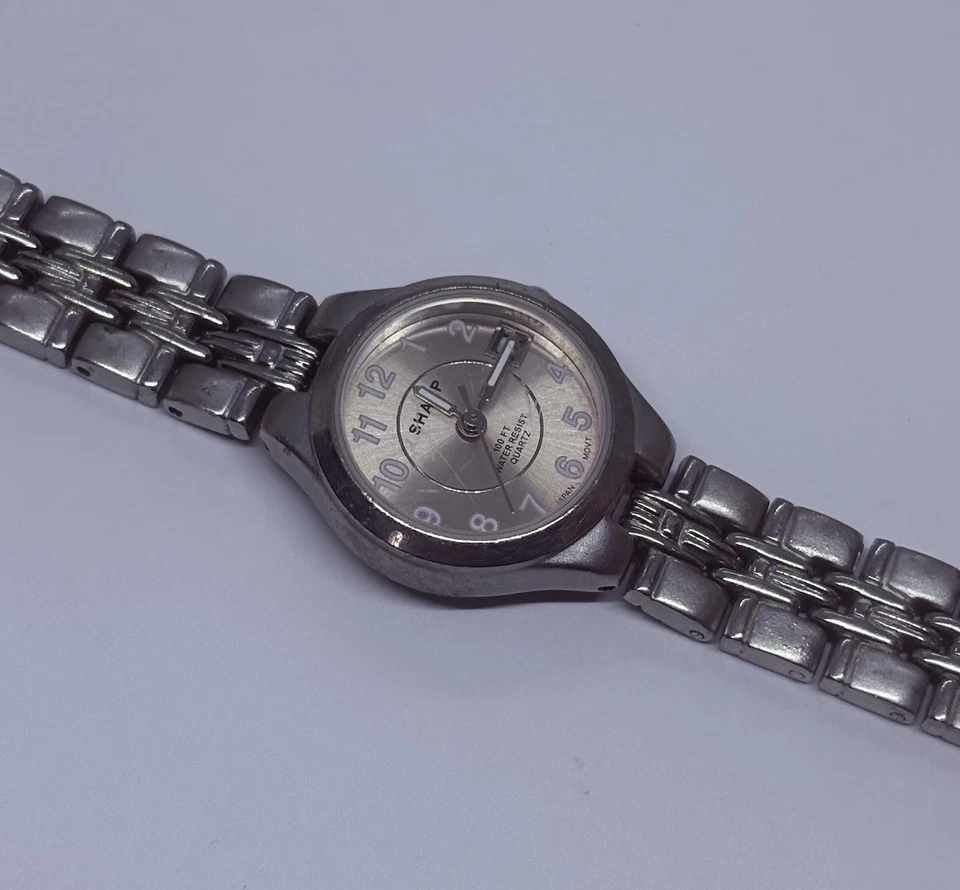 Reloj para mujer Sharp SHP5304 vintage 23 mm tono plata fecha 7,25” esfera rosa 31 Foto 3 de 4