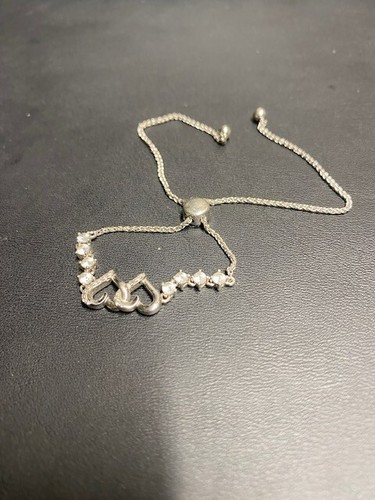 925 STERLING SILVER AND COLORLESS TOPAZ TWO HEARTS BRACELET WITH BOLO CLOSURE - Picture 2 of 7