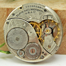 Antique 1921 Elgin 303 12 size 7 jewel pocket watch movement with dial  hands