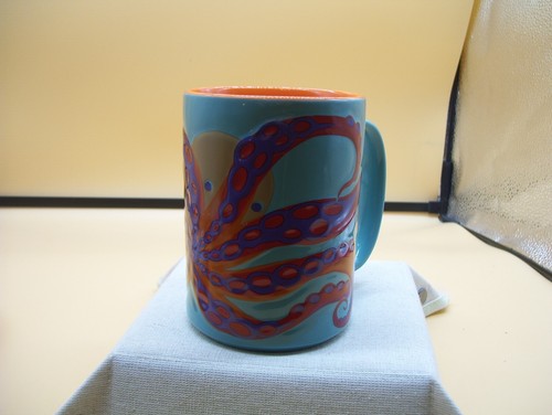 Taza de café Kitsch N Glam pulpo Takoyaki turquesa naranja