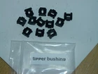 12 black plastic tipper bushings for Lesney Matchbox tippers, etc. with bushings