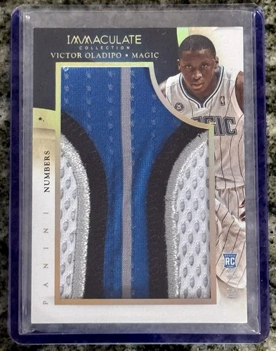 2013-14 Panini Immaculate Collection - Team Logos Victor Oladipo /50 (MEM, RC)