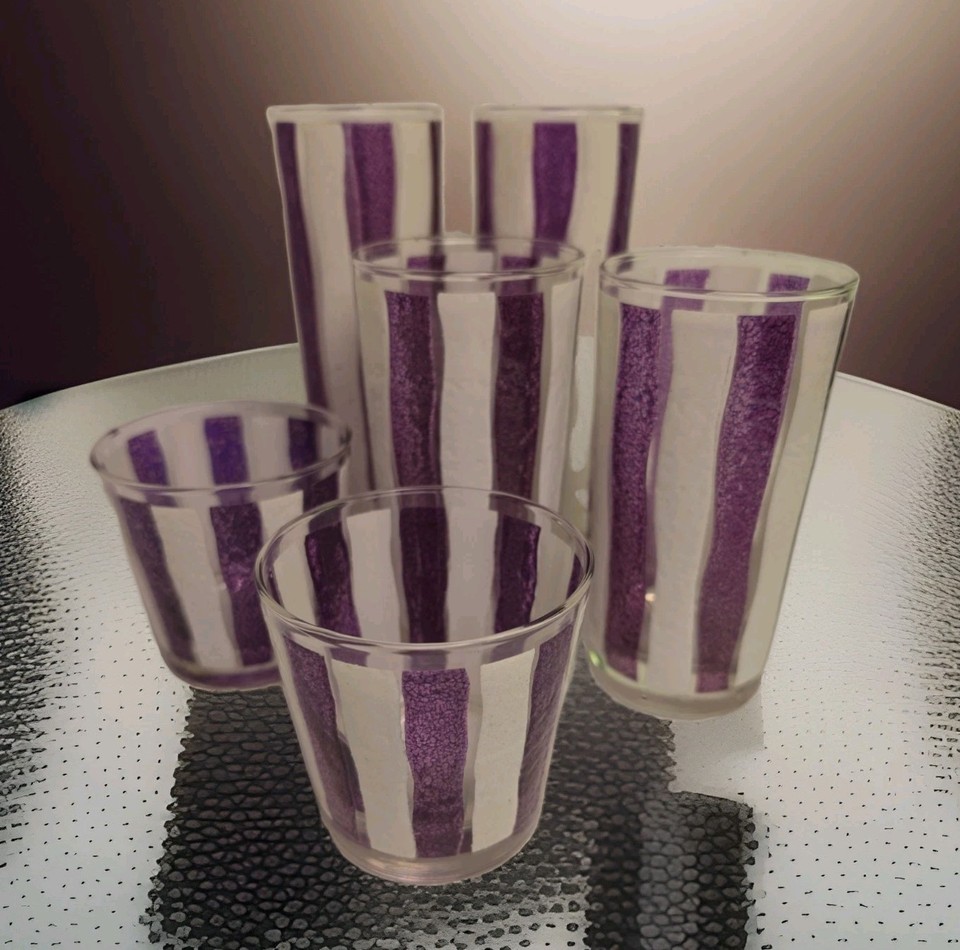 A complete set of 6 Libbey awning-stripe purple and white MCM glasses is peak 1950s backyard-party aesthetic — graphic, cheerful, and genuinely hard to find complete.