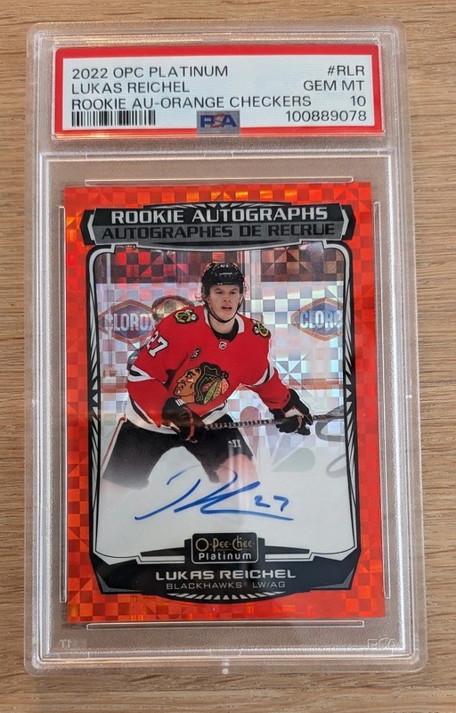 2022-23 OPC Platinum Lukas Reichel Orange Checkers Rookie Auto /15 PSA 10 RC SSP