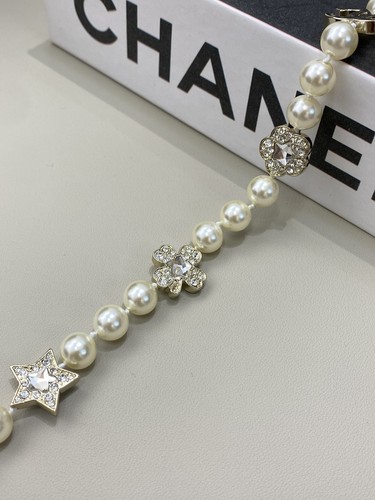 Collier officiel CHANEL or clair quincaillerie étoile flacon de parfum forme CCS perles courtes