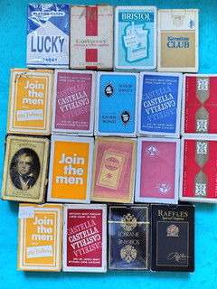 18 packs of tobacco themed playing cards; some sealed/unused.