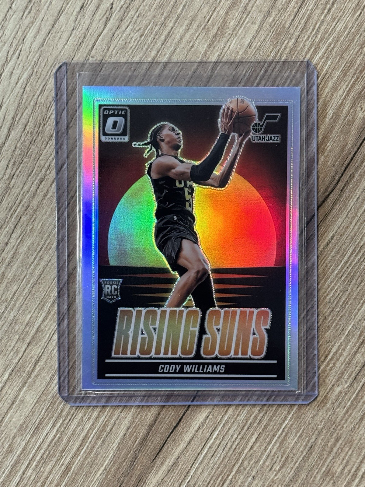 2024-25 Donruss Optic Cody Williams Rising Suns Holo Prizm RC #8 Utah Jazz