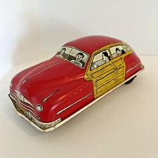 COURTLAND TOY COMPANY TIN FRICTION WOODIE WAGON CHRYSLER RED USA APPROX 7"X3.2"