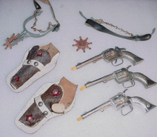 LOT: 2 Hubley PAL  1 Kilgore Western Cap Gun set W/2 Jeweled Holsters  1 Spur