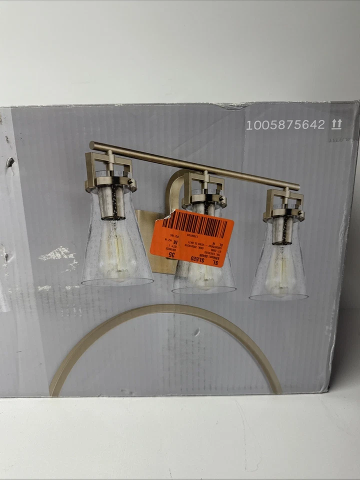 Luz de tocador de baño de latón satinado Vess de 3 luces con pantallas de vidrio transparente con semillas Foto 3 de 4