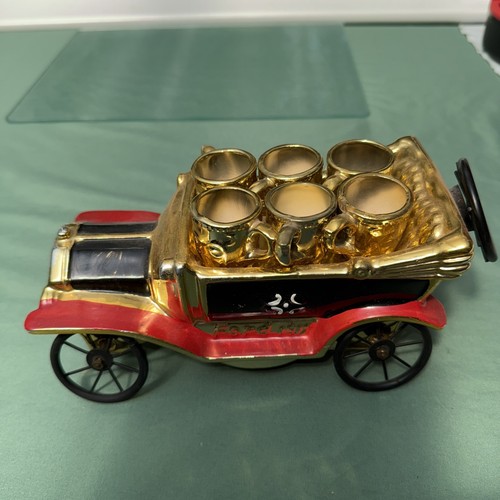 Vintage Musical Model Car. Drink Container and has miniature gold cups.