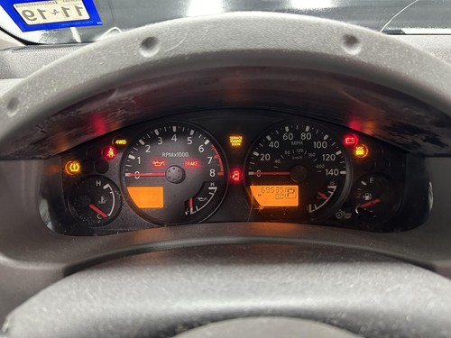 2011 Nissan Xterra OEM 140MPH Speedometer (24810-9CA5A) Cracked Lens (Tested) - Picture 2 of 15