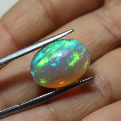 7.7 Cts 16.6x12.3 MM Natural AAA Rainbow Fire Light Gray Ethiopian Opal Oval Cab - Picture 2 of 13