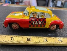 Vintage Walt Disney Products Friction Mad Hatters Sky View Taxi Cab Tin Toy Car