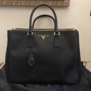 black and gold prada bag