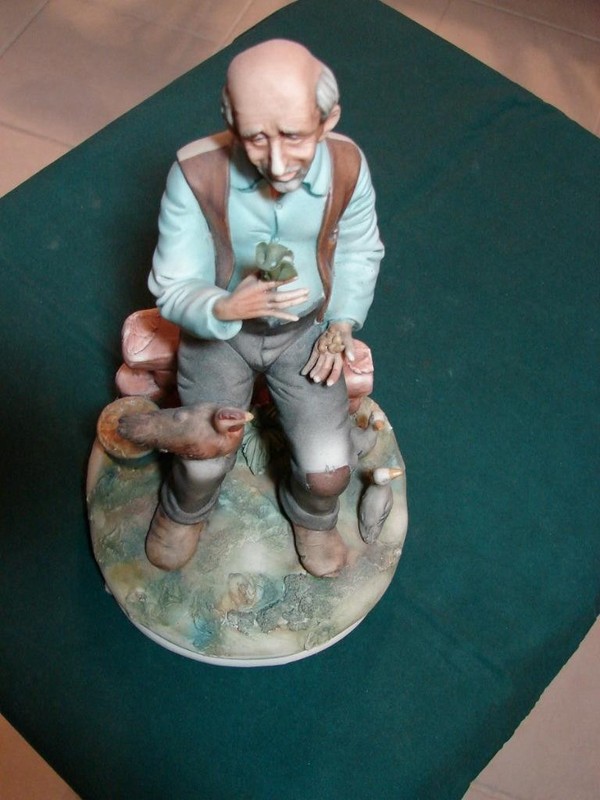 Capodimonte Figurine Man on bench feeding Birds/Ducks artist signed number 138