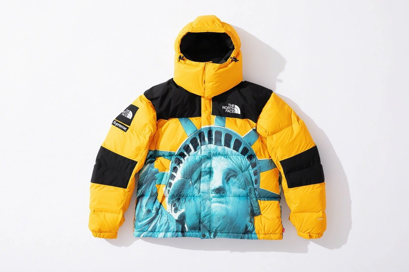 Veste jaune tampon suprême face nord Statue de la Liberté Baltoro à la main taille M