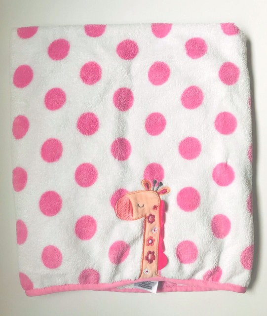 pink blanket with white polka dots